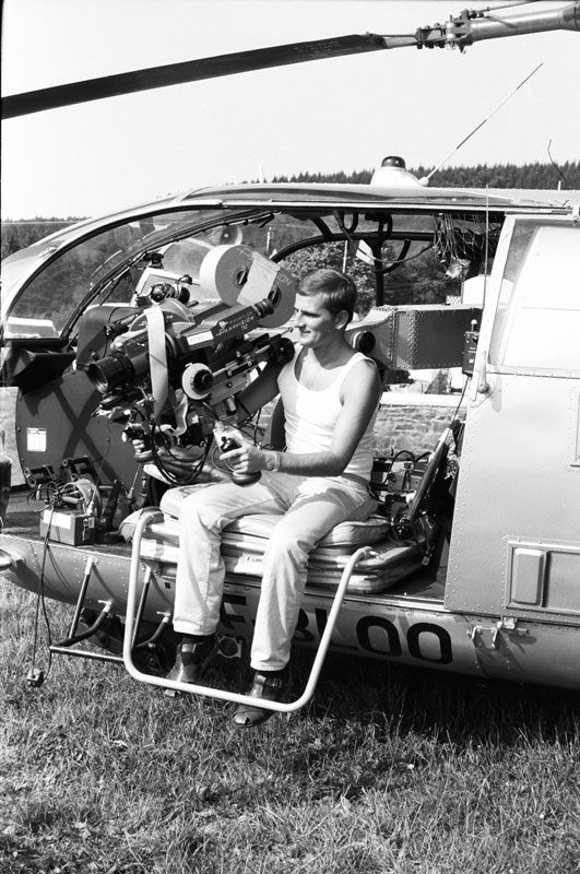 Otto rigging a camera in a helicopter